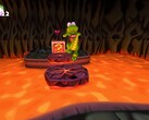 Скриншот Croc Legend of Gobbos показывает, как Крок прыгает через лаву